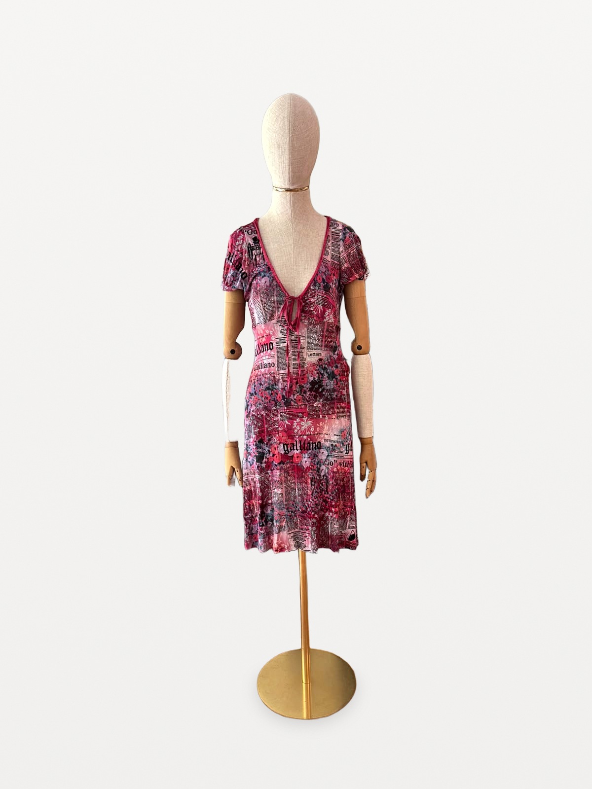Galliano Galliano dress by John Galliano featuring a ‘Gazette’ newspaper print in shades of pink